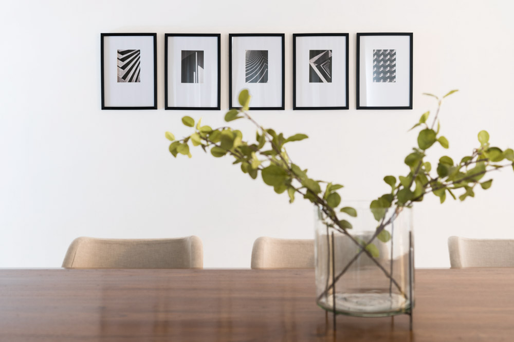 Wall art & small house plant to enhance your dining room design - Beautiful Homes