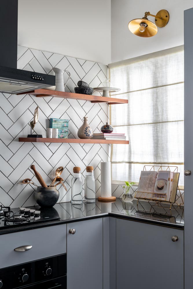 The blue & white kitchen has floating shelves for display & storage - Beautiful Homes