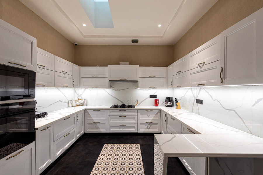 A U-shaped kitchen with white cabinets - Beautiful Homes