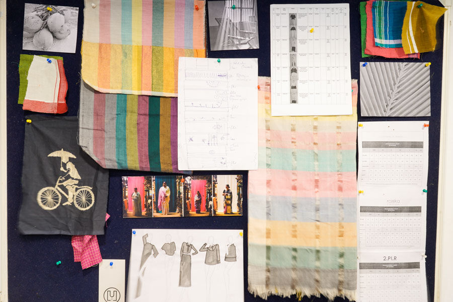 Some cloth samples and sketches pinned on a board - Beautiful Homes