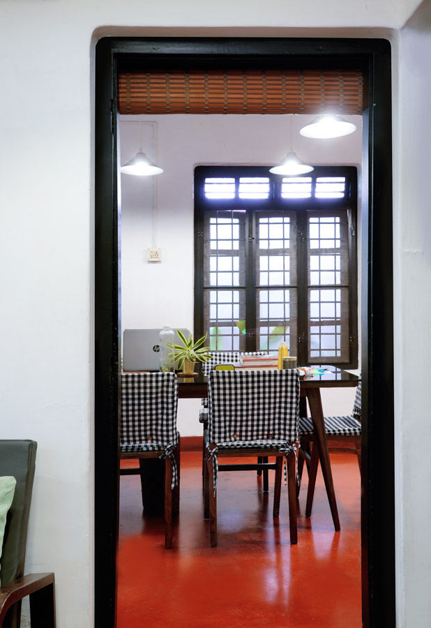 A home office with the floor painted in red oxide - Beautiful Homes