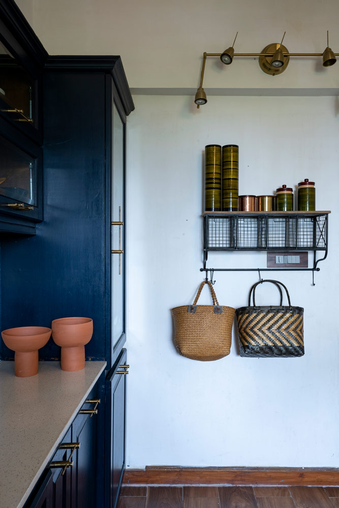 Channapatna wood storage jars have been repurposed in the kitchen design - Beautiful Homes