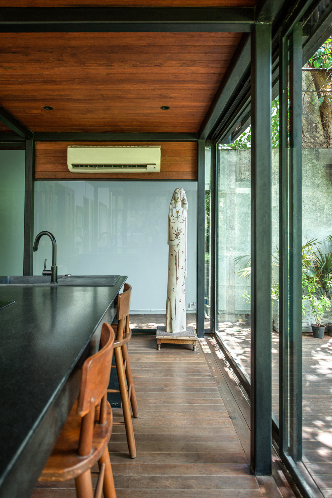 The ground-floor kitchenette has bar stools that have been custom-designed by a local carpenter - Beautidul Homes