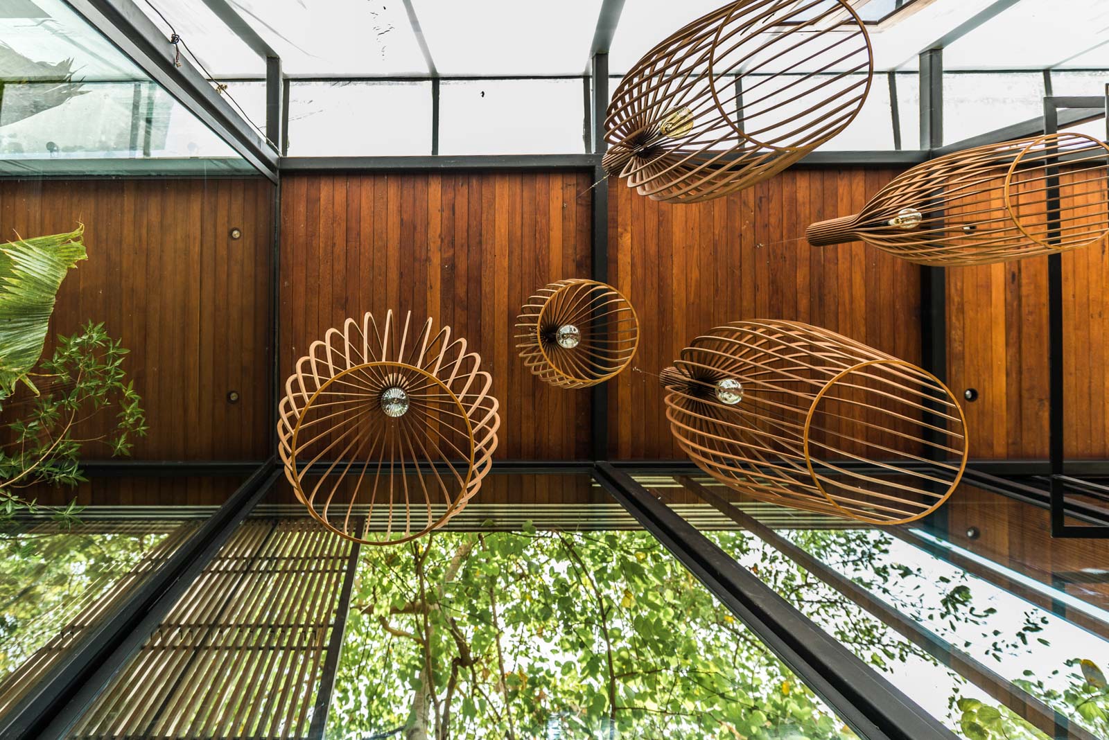 The CNC-cut MDF (medium-density fibreboard) lights hanging from the ground-level ceiling - Beautiful Homes