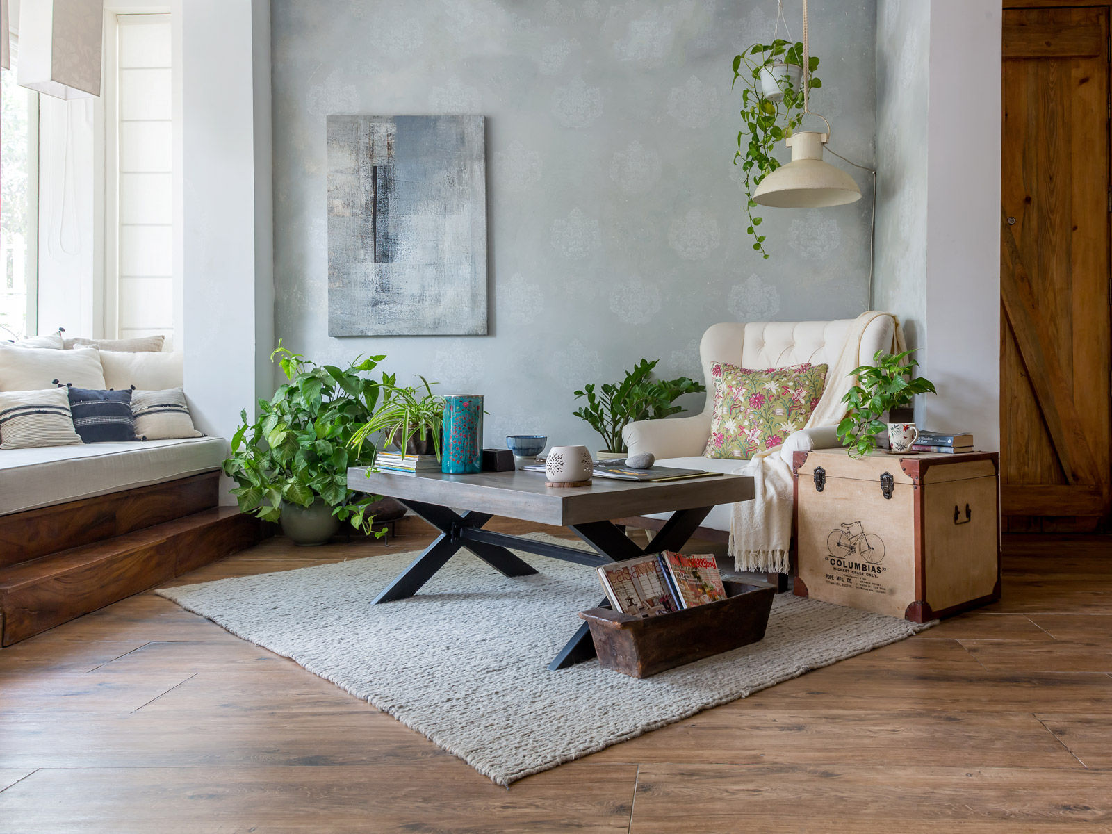 The living area has a cosy alcove fitted with plush cushions - Beautiful Homes