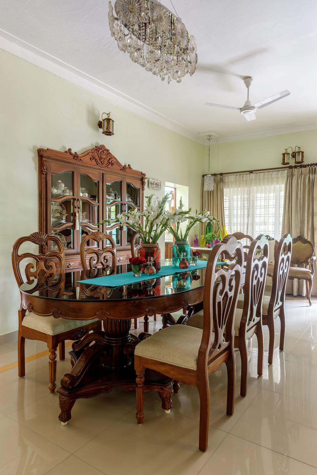 The heavily carved dining table in the dining room - Beautiful Homes