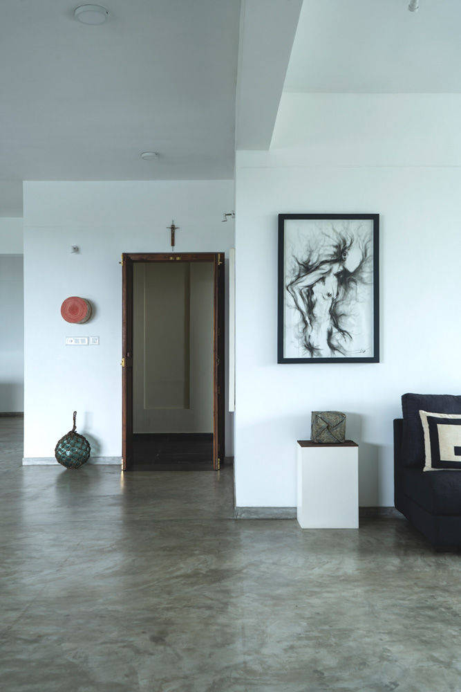 The living room décor has artword around the walls - Beautiful Homes