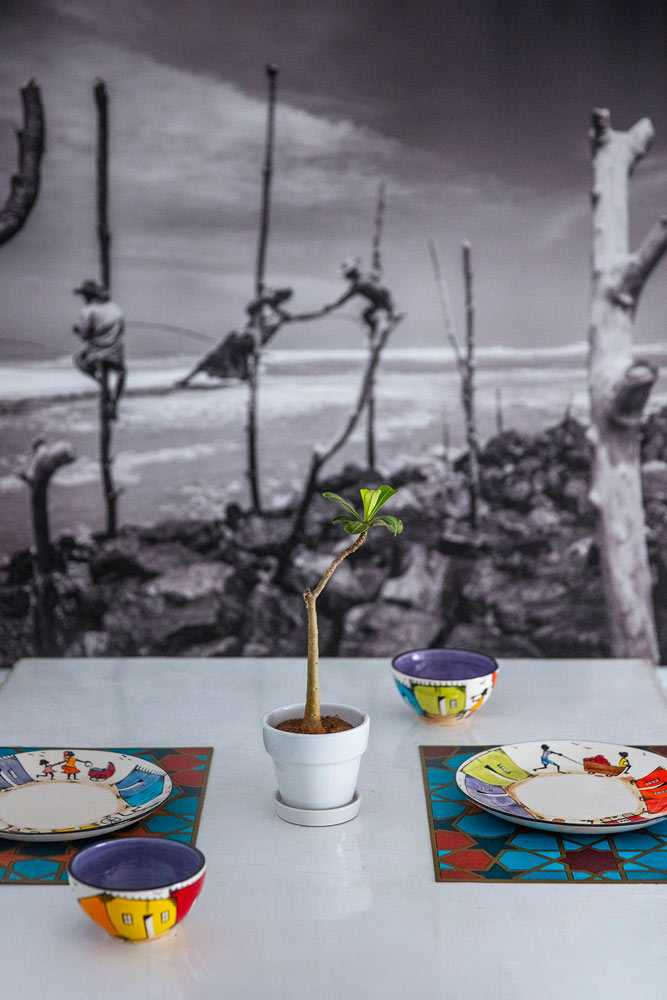 Hand-painted crockery sits on the dining table - Beautiful Homes