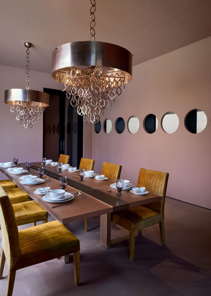 Pinakin Patel's dining room design in the villa with wooden dining furniture & designer chandeliers - Beautiful Homes