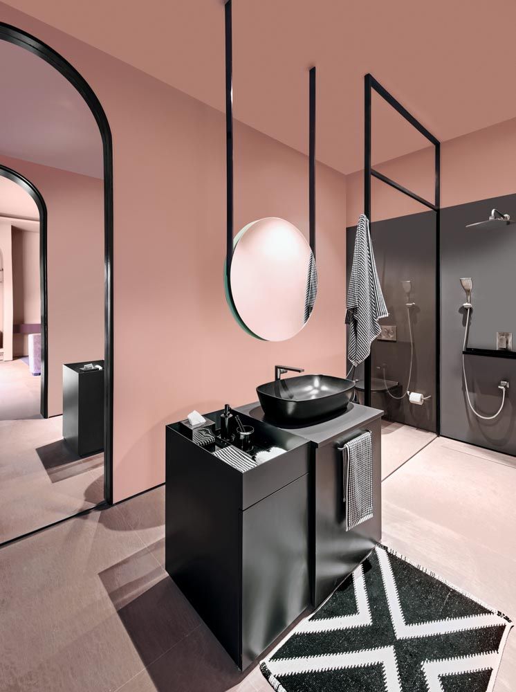 Spacious bathroom design of the villa has pink walls & dark theme bathroom décor - Beautiful Homes