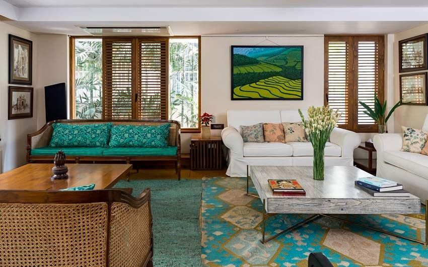 A blend of modern & traditional living room with forest green designer rugs for décor - Beautiful Homes