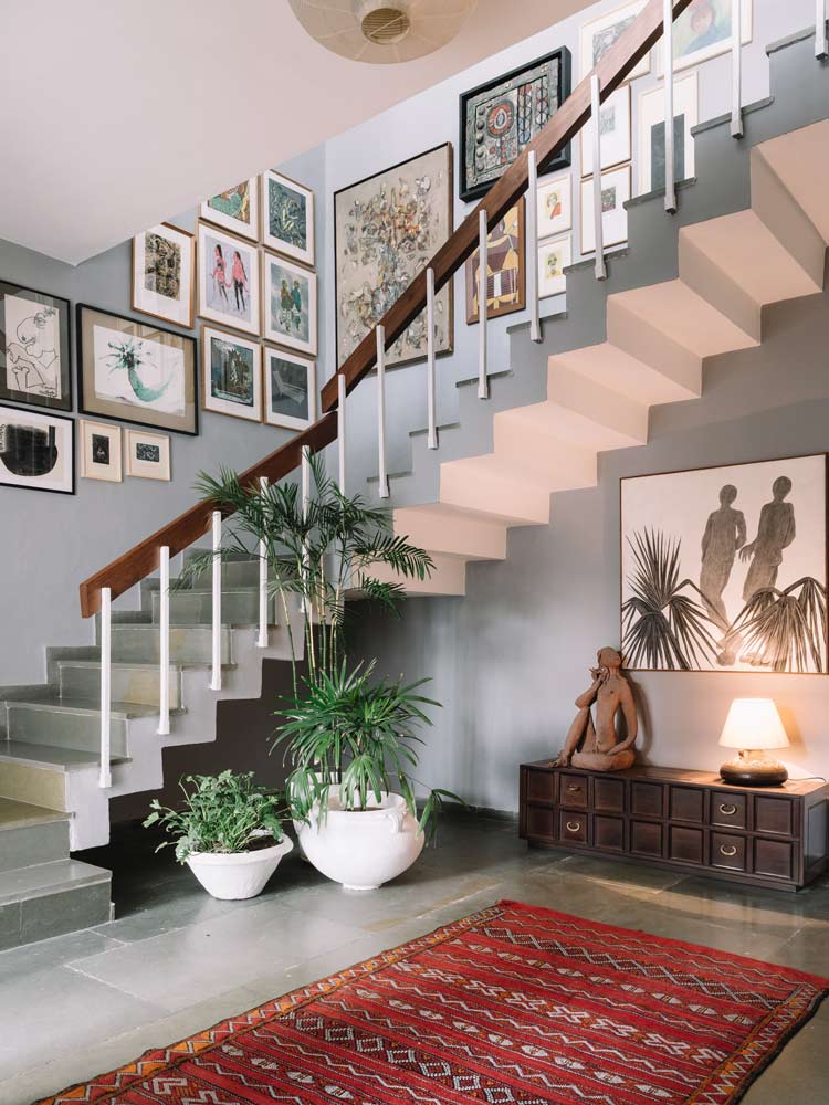 Well structured modern staircase design with stone floor & beautiful wall arts - Beautiful Homes