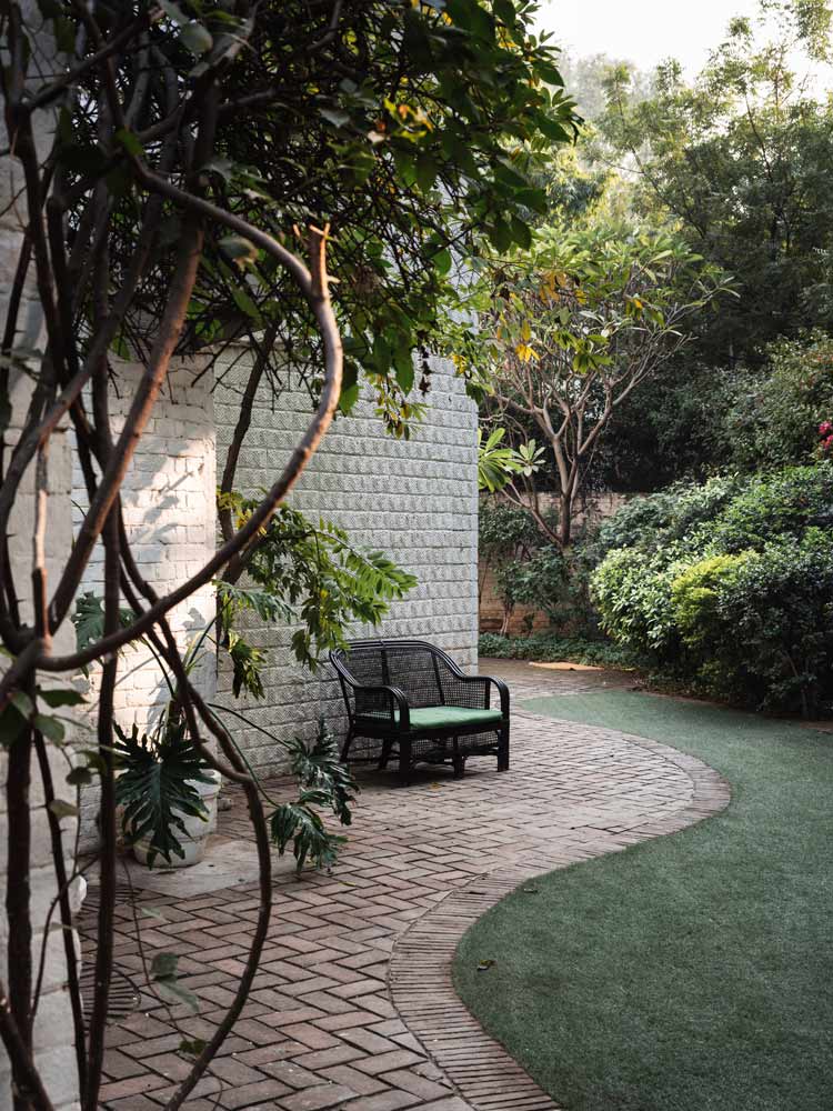A well maintained backyard around the house with beautiful foliage & seating space - Beautiful Homes