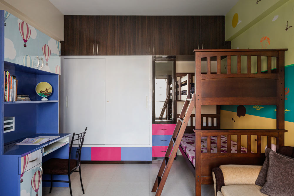 Printed laminate designs with pink & blue wall colour palettes for kids bedroom - Beautiful Homes
