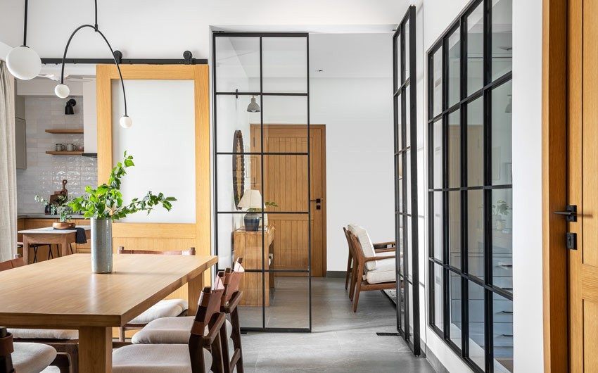 View from the hallway that leads into the dining room, with the kitchen & living room beyond - Beautiful Homes