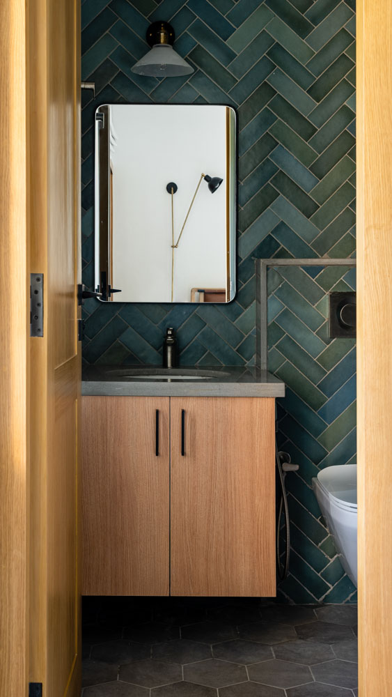 The guest bathroom has patterned tiles from Ceramique & fittings from Kohler - Beautiful Homes