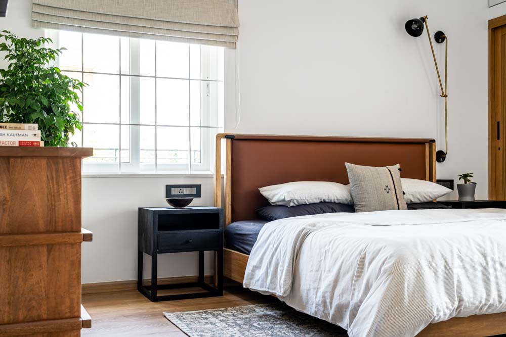 Furniture in the guest bedroom is custom-made & wall light from The Black Steel  - Beautiful Homes