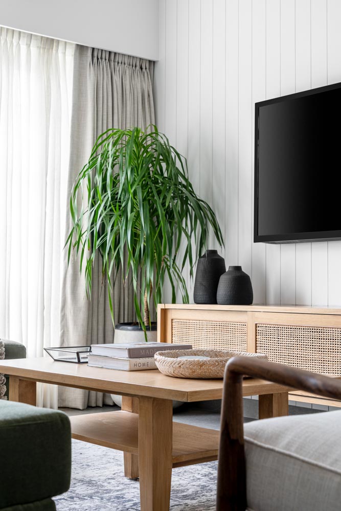 Living room wall with vertical panelling & oak- veneered TV cabinet - Beautiful Homes