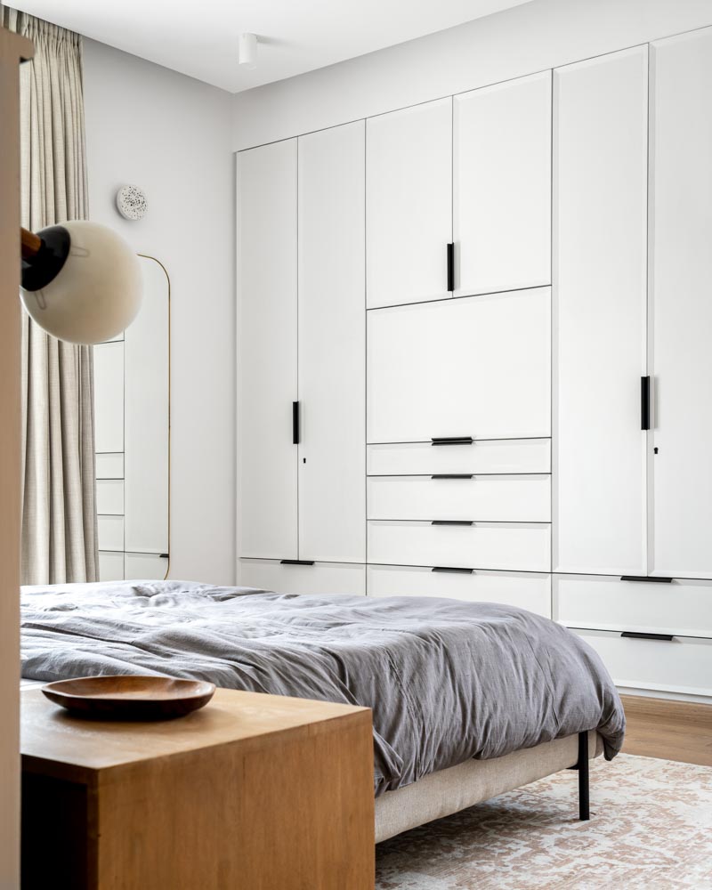 "Master bedroom has wardrobe shutters with tapered details finished in PU paint - Beautiful Homes"