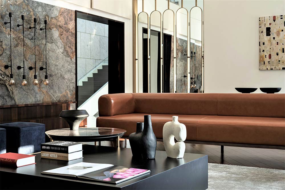 Mirror partition décor with leather sofa - Beautiful Homes