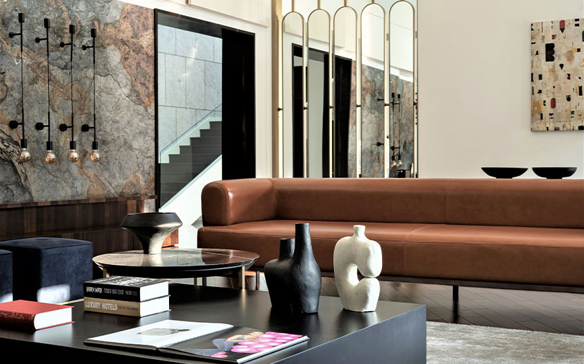 Mirror partition décor with leather sofa - Beautiful Homes