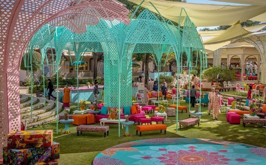 A colourful set up for a wedding spread on a lawn 