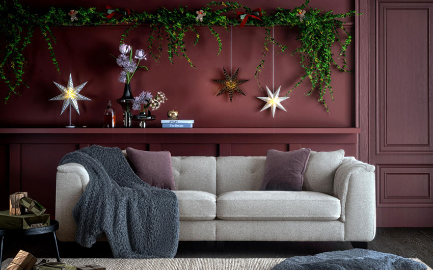 Minimalist’s living room design for Christmas with a wreath on a door   - Beautiful Homes