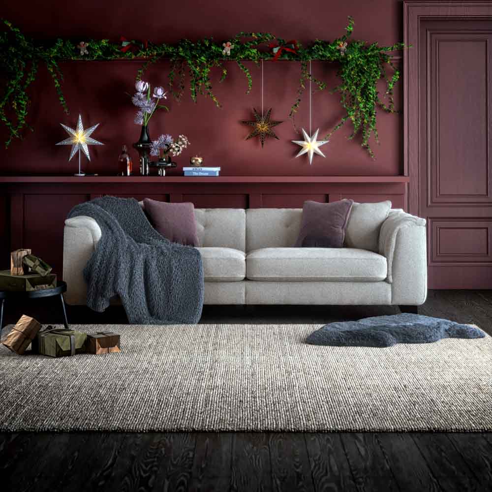 Minimalist’s living room design for Christmas with a wreath on a door   - Beautiful Homes