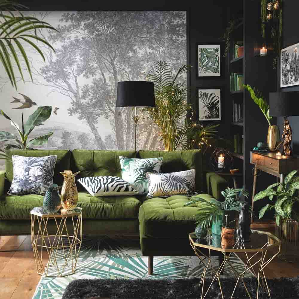 Christmas living room décor in a verdant colour palette with palm-leaf accessories and fairy lights - Beautiful Homes