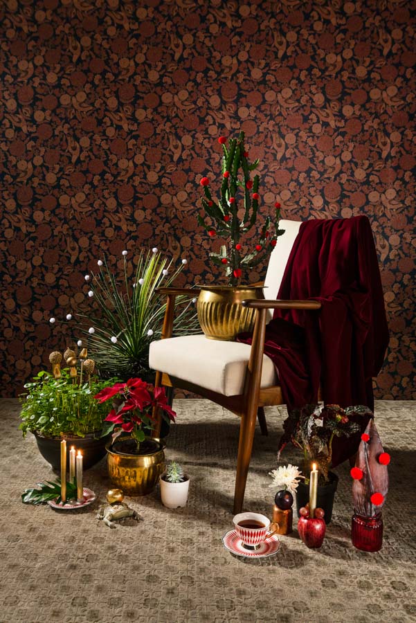 Putting together a combination of simple festive elements with the regular house plants makes for a really unique Christmas tree setting - Beautiful Homes