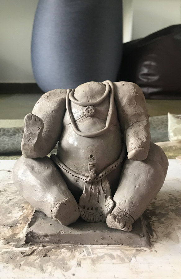 The arms and legs with the help of a little water and clay is added to the idol - Beautiful Homes
