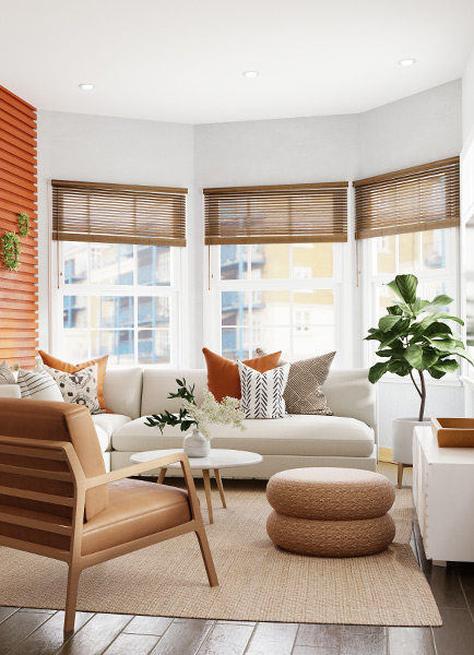 A neatly organised living room with white and beige furnishings