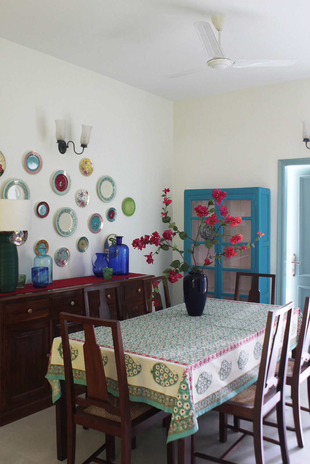 A flower arrangements with flowers and florets on the dining table - Beautiful Homes