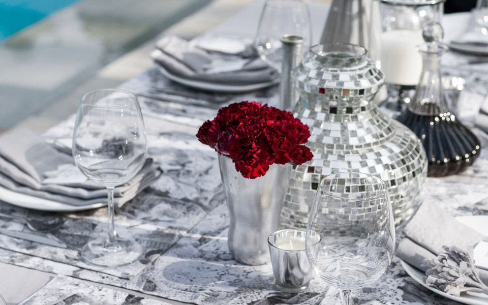 Chic cocktail setting with a mix of shiny silver and pristine whites