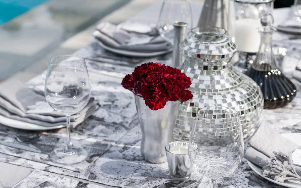 Chic cocktail setting with a mix of shiny silver and pristine whites