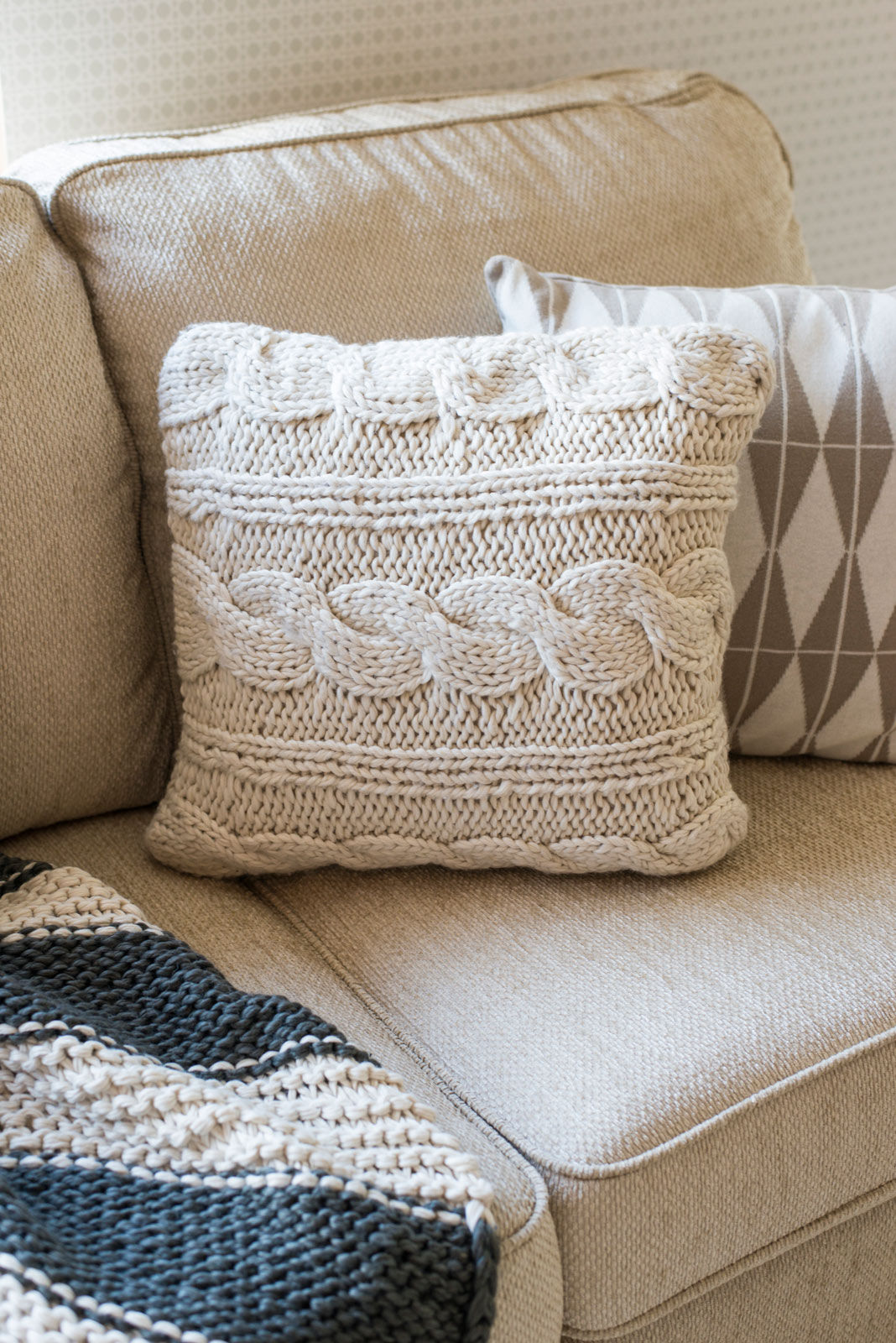 A woollen soft furnishings in a cosy living room - Beautiful Homes