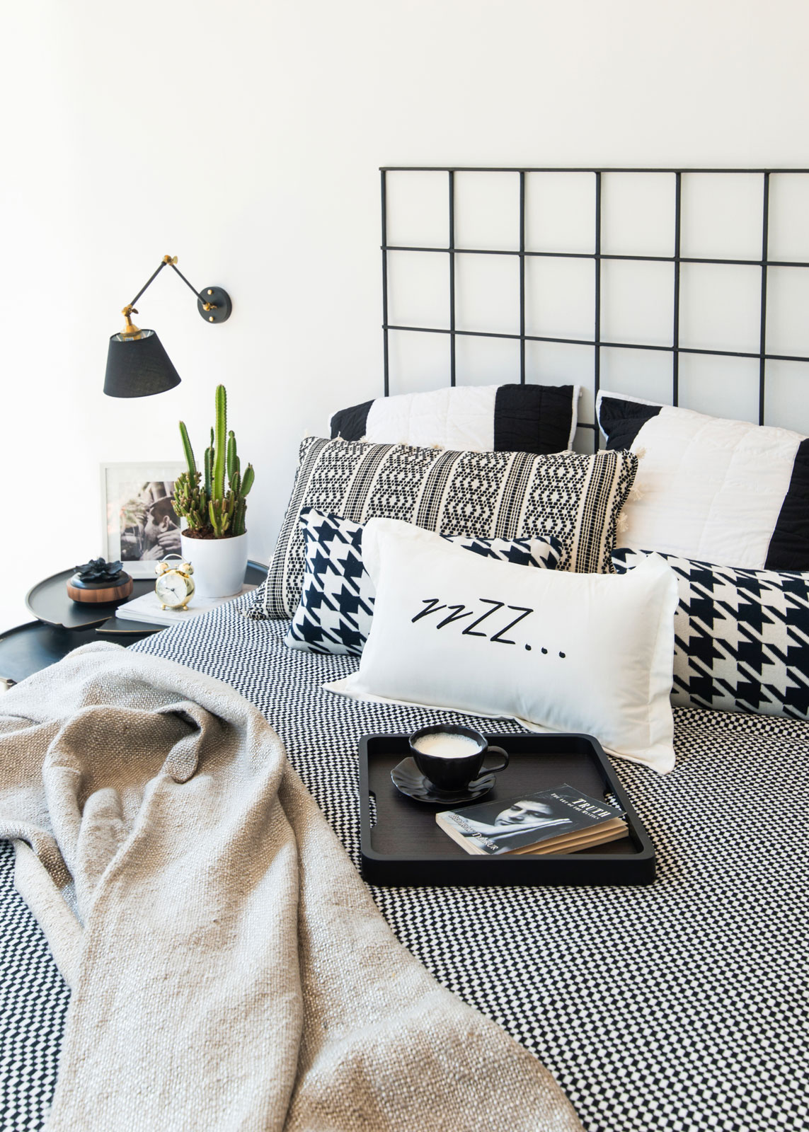 Black, White & Grey Bedroom Design With Black Wall Lamp & Side Table - Beautiful Homes