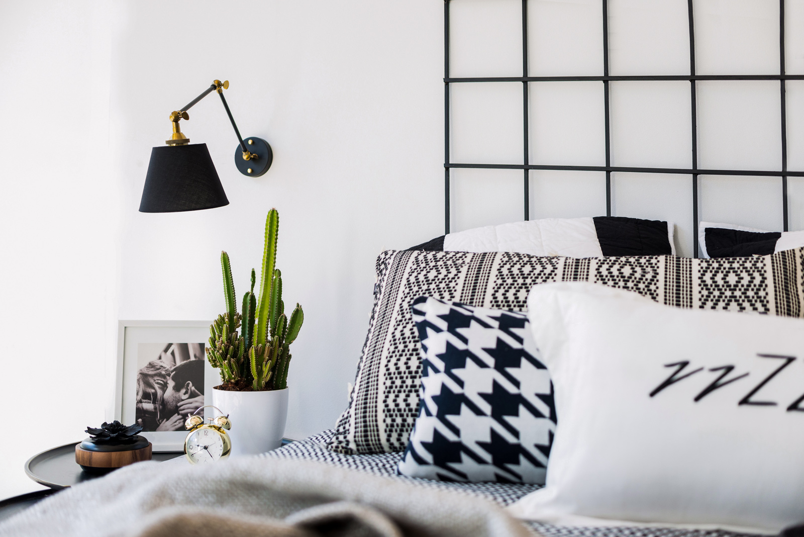 Bedroom Design in Black & White Colour With Black Wall Lamp & Side Table - Beautiful Homes