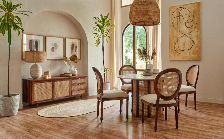 A dining room with a dining table with four chairs