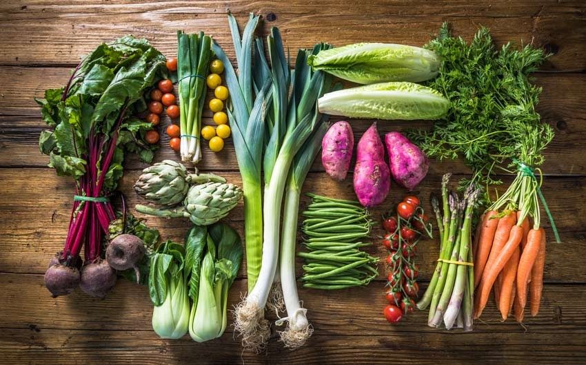 Vegetables placed on a wooden surface