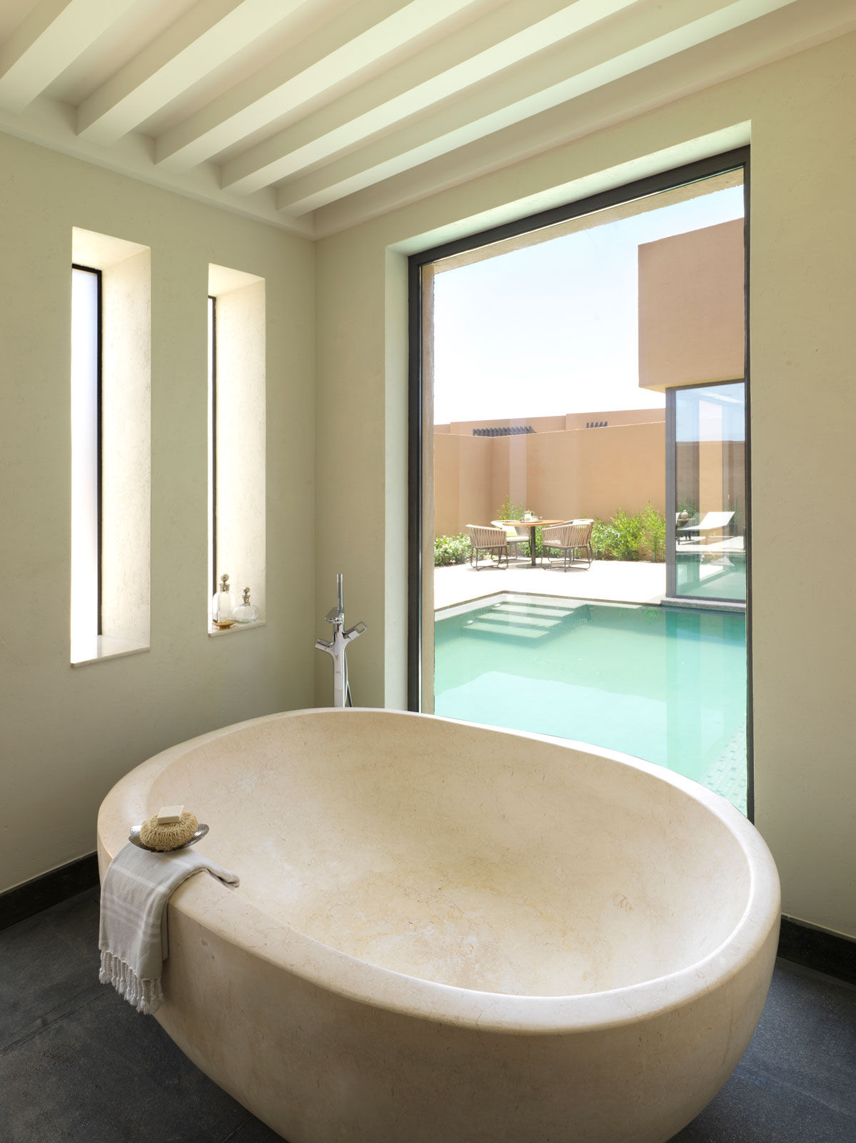 A Monolith Bathtub at the Bathroom of the Garden Pool Villa - Beautiful Homes