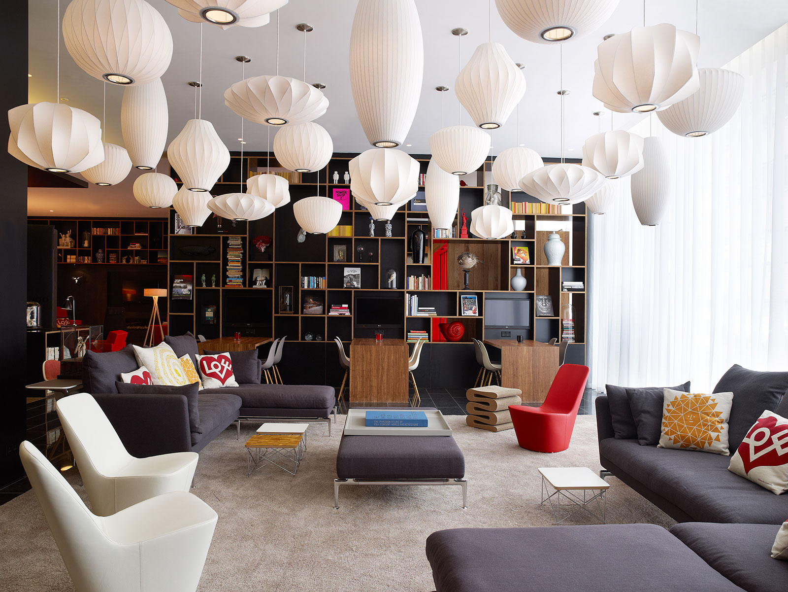 A cluster of pendant lamps hung from the ceiling at the citizenM hotel in London - Beautiful Homes