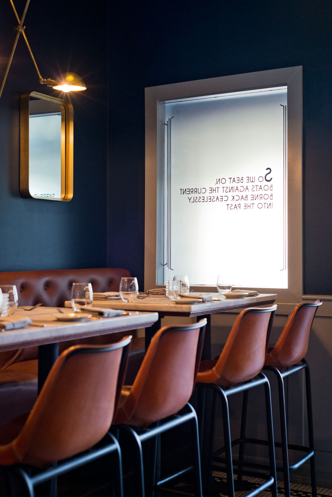 The interiors of the seating area at the Gatsby’s Landing in Roslyn, New York - Beautiful Homes