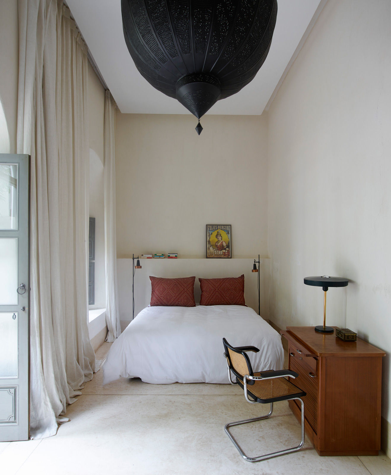 A simple sleeping area can be made much more dramatic with the addition of a large light fixture – Beautiful Homes