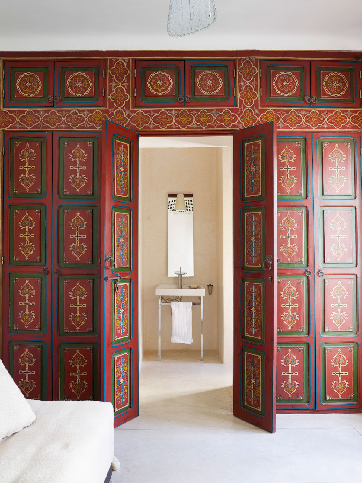 Another way to inject colour in the room is by using colourful, patterned doors in bold colours - Beautiful Homes