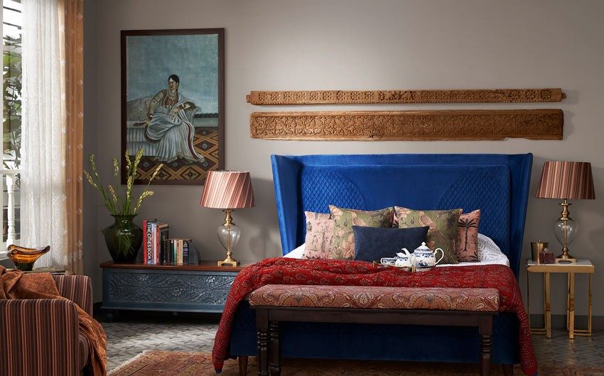 Bedroom with a wooden bed with a blue headboard