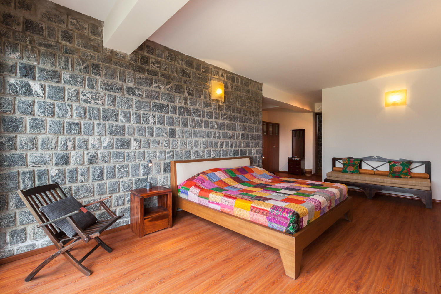 Bedroom Design with Wooden Bed, Wooden Flooring and Brick Style wall - Beautiful Homes