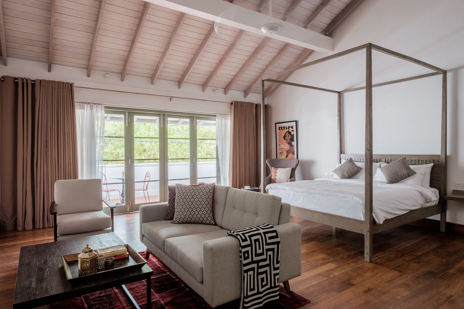 A simple four-poster bed made from wood or metal - Beautiful Homes