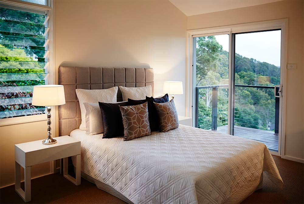 Bedroom wall paint yellow with velvet headboard - Beautiful Homes