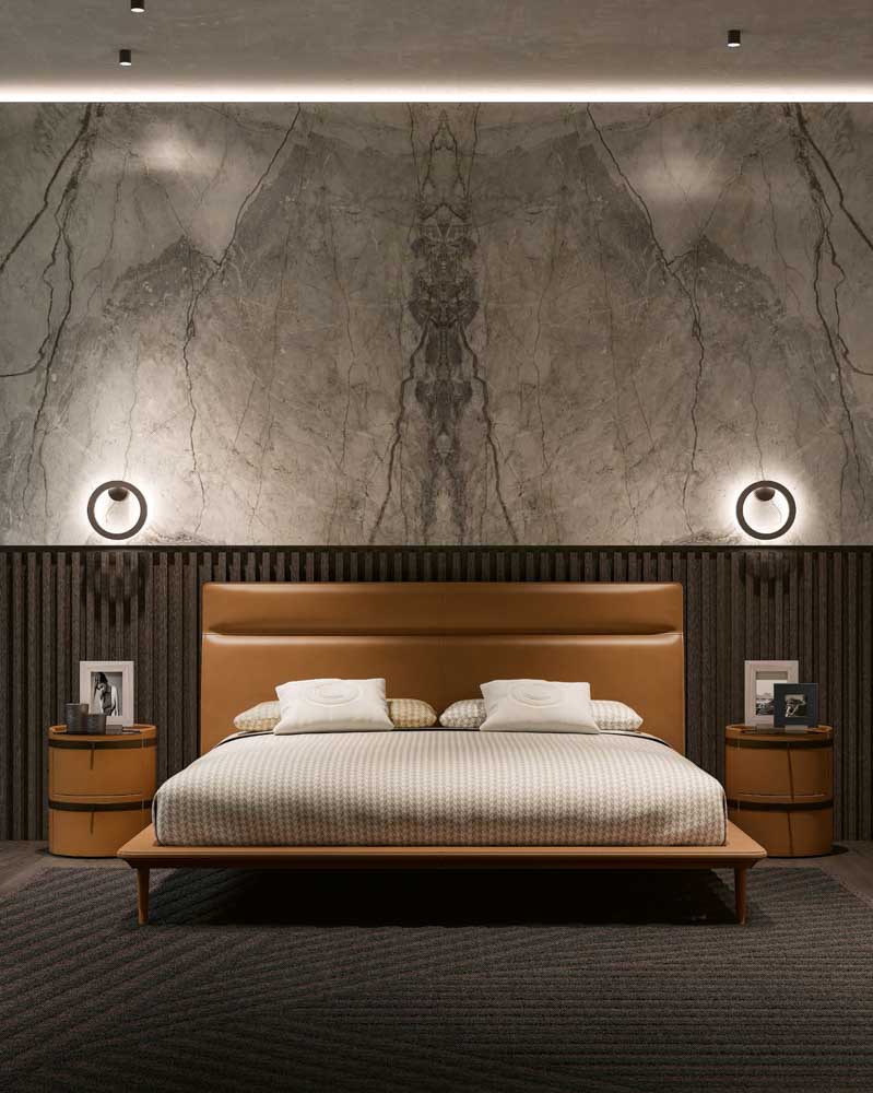 Marble-veined accent wall & leather-upholstered bed for bedroom - Beautiful Homes